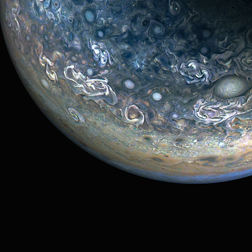 Swirling, color-enhanced clouds and cyclonic storms in Jupiter's northern hemisphere